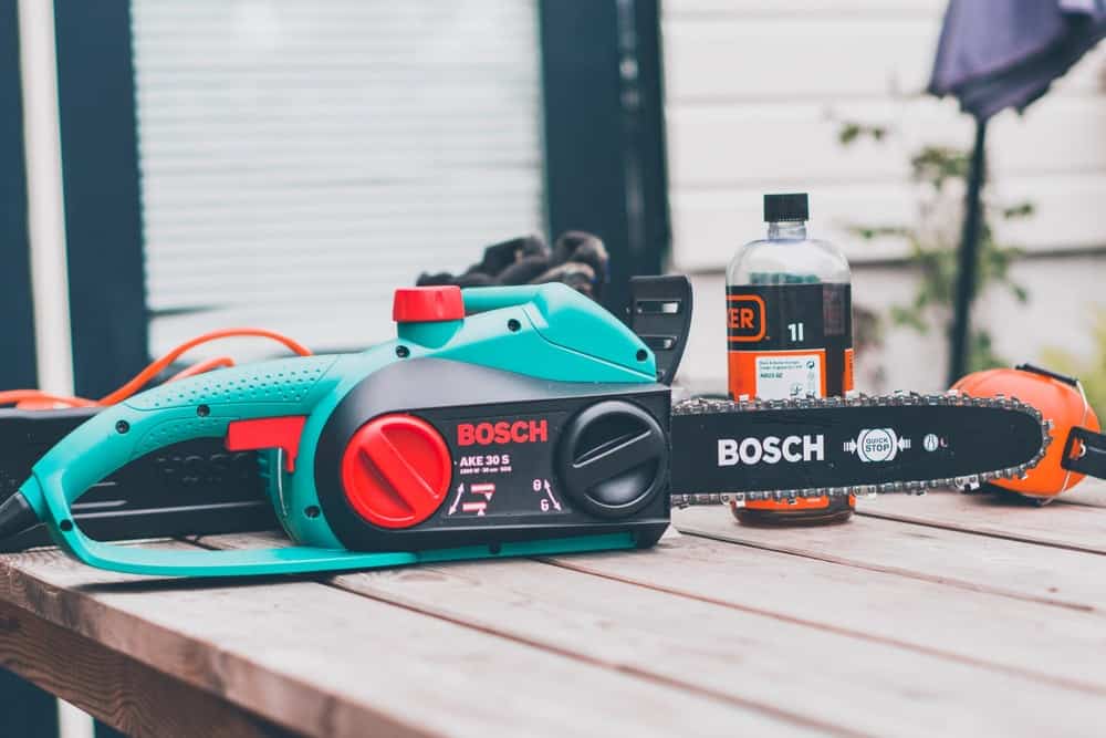 Black and teal Bosch chainsaw